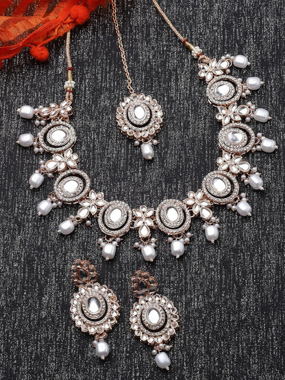 Sukkhi Traditional Gold Plated AD Stone Collar Bone Necklace Set With Earring And Maangtika | Jewellery Set For Women (NS105700)